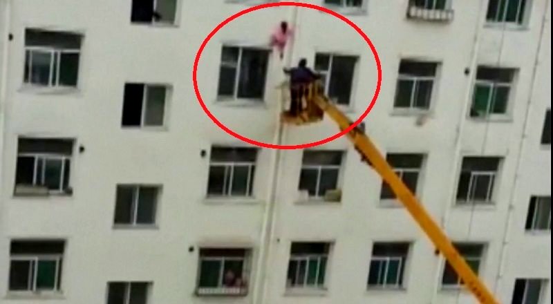 Hero Pulls Off Dramatic Rescue of a Little Girl Dangling From a Building in China