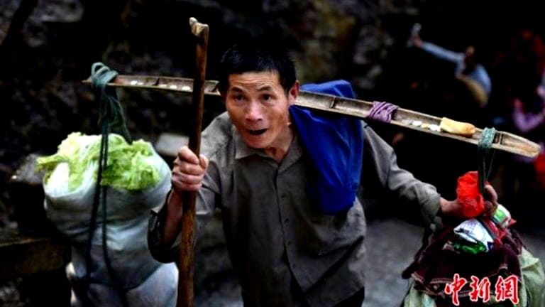 Chinese Grandpa Carries 150 Pounds of Supplies Up a Mountain Everyday For $12