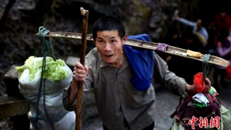 Chinese Grandpa Carries 150 Pounds of Supplies Up a Mountain Everyday For $12