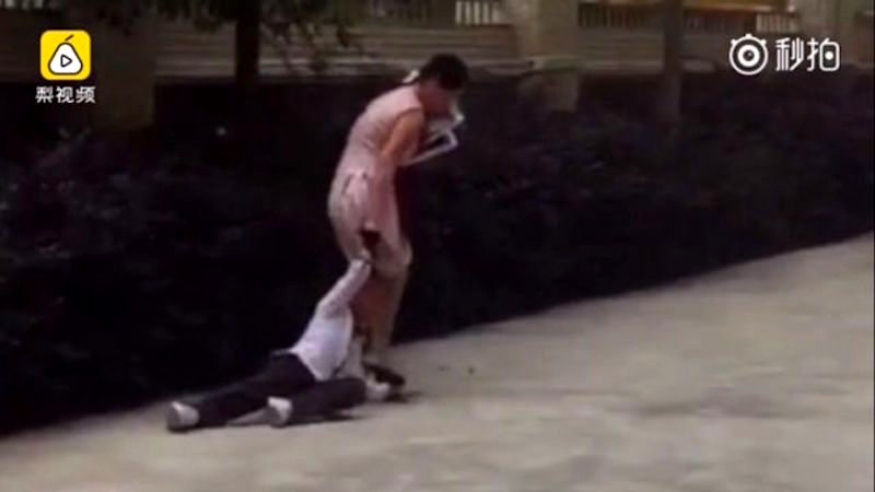 Teacher in China Sparks Outrage After Being Caught on Camera Dragging Student By Her Hair