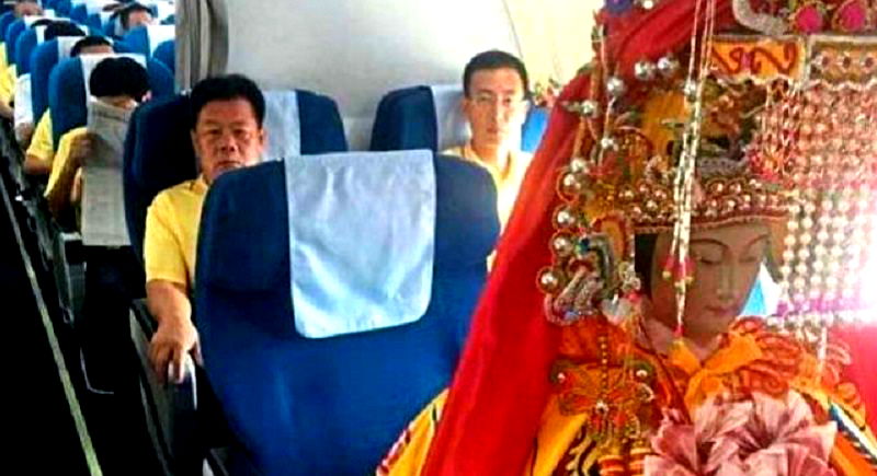 Chinese God Statues Flying in Business Class Puzzle Travelers