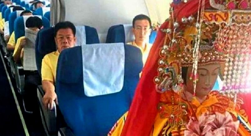 Chinese God Statues Flying in Business Class Puzzle Travelers