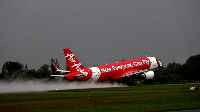 Indian Man Attempts to Open Emergency Door on AirAsia Flight While Midair