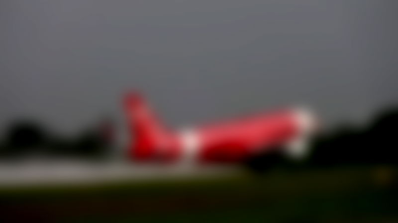 Indian Man Attempts to Open Emergency Door on AirAsia Flight While Midair