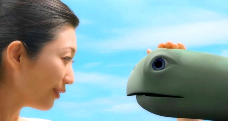 Japanese Ad Sparks Outrage With Sexy Model Stroking Turtle’s Head