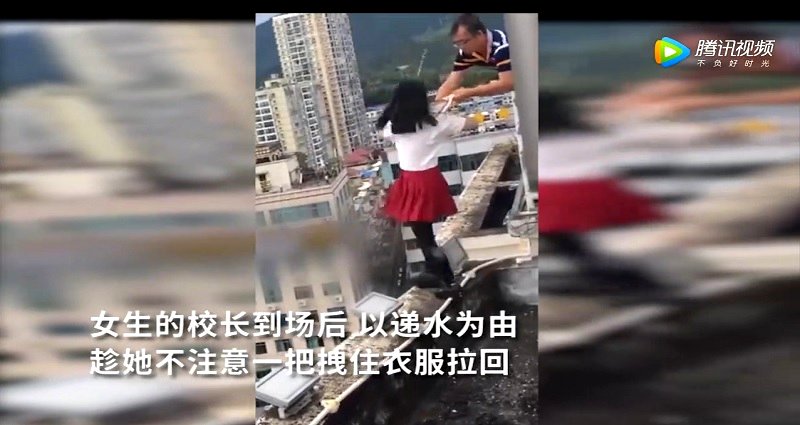 Chinese Principal Saves Suicidal Girl by Grabbing Her Shirt Before She Jumps 17 Stories