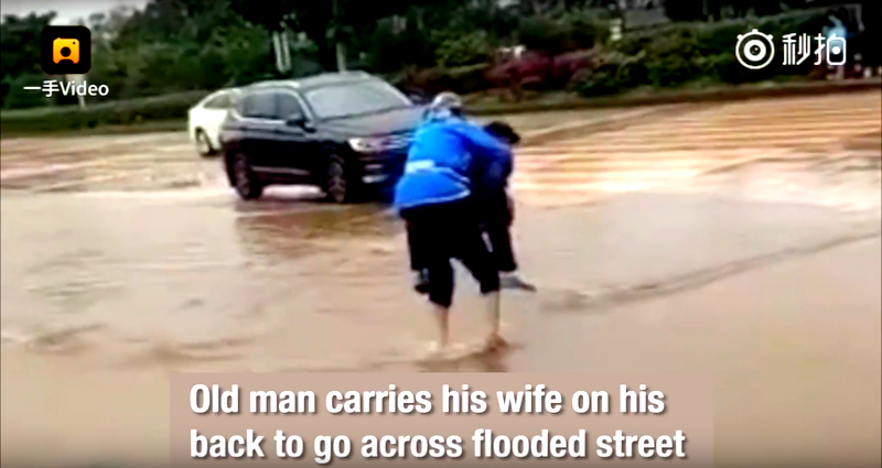 Elderly Chinese Man Carrying His Wife Across Flooded Street is Most Definitely True Love