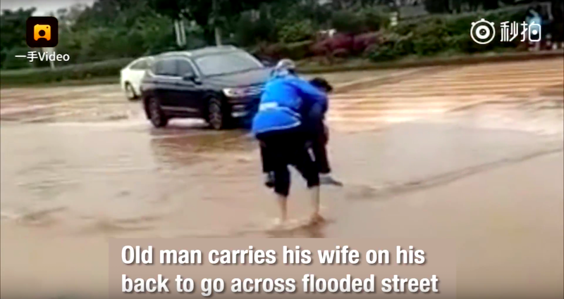 Elderly Chinese Man Carrying His Wife Across Flooded Street is Most Definitely True Love