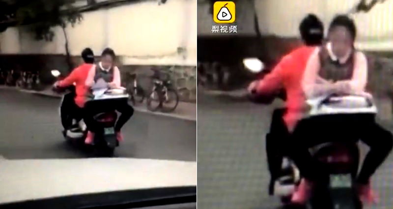 Chinese Student Caught Doing Her Homework on the Back of a Moving Motorcycle