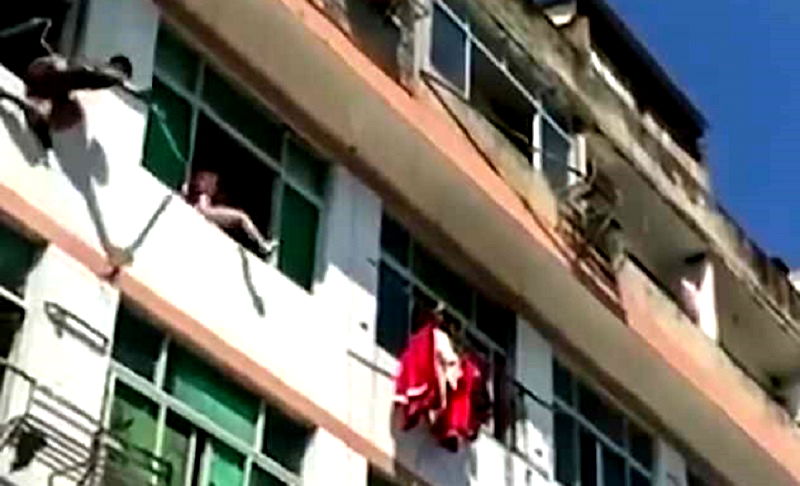 Chinese Firefighters Use Water Hose to Stop Suicidal Woman From Jumping ...