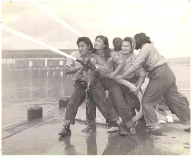 A photograph of four young women purportedly hosing a fire during the Japanese attack on Pearl Harbor has appeared on several mainstream publications and history books as an iconic symbol of determination against adversity.