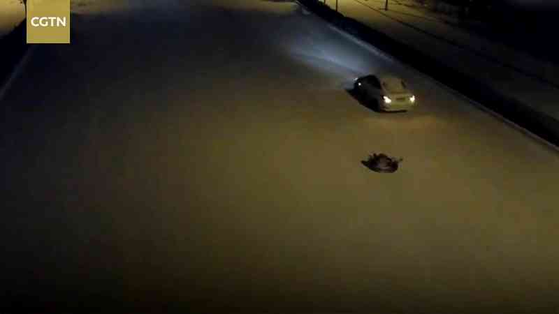 A father from Hebei, China has been summoned by the police after he was caught pulling his son on a tire sled through an icy road.