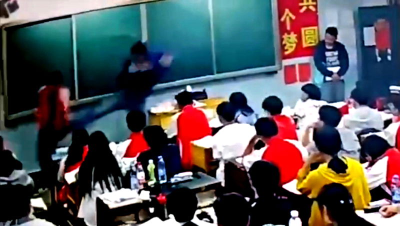 A middle school teacher in southern China has been suspended after assaulting two male students in front of the class.