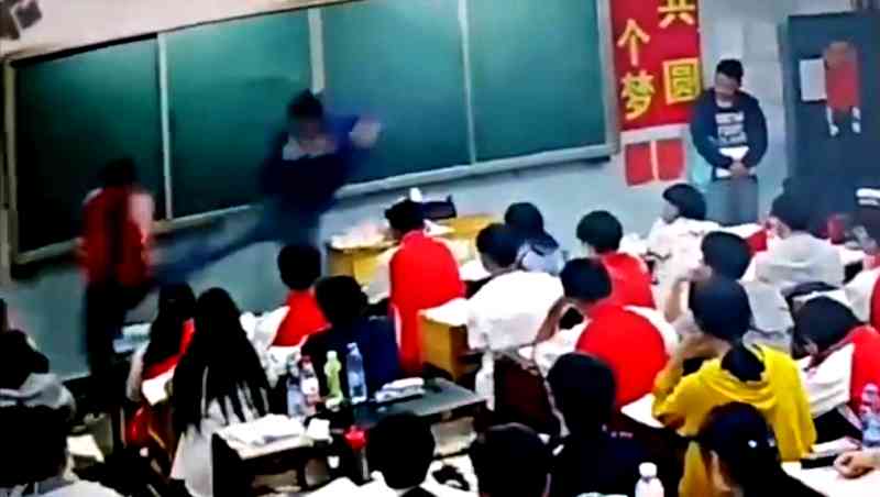 A middle school teacher in southern China has been suspended after assaulting two male students in front of the class.