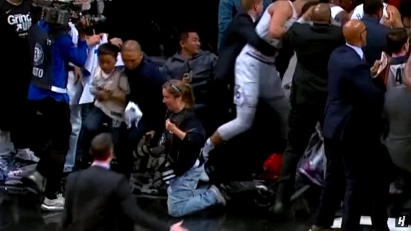 An Asian man who swiftly took his son away from a courtside ruckus is being hailed as “Dad of the Year” on social media.