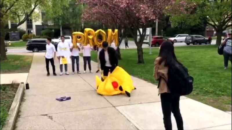Sometimes simply going up to someone and asking them out to prom isn't extravagant enough which is why this student chose to ask a girl out in public while wearing a massive Pikachu costume.