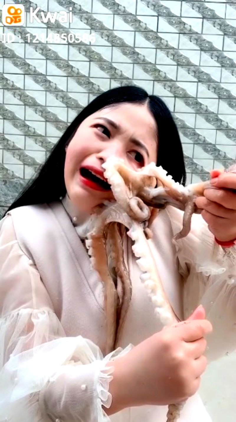 A Chinese livestreamer found her face writhing in pain as an octopus tried to defend itself in her attempts to eat it alive.