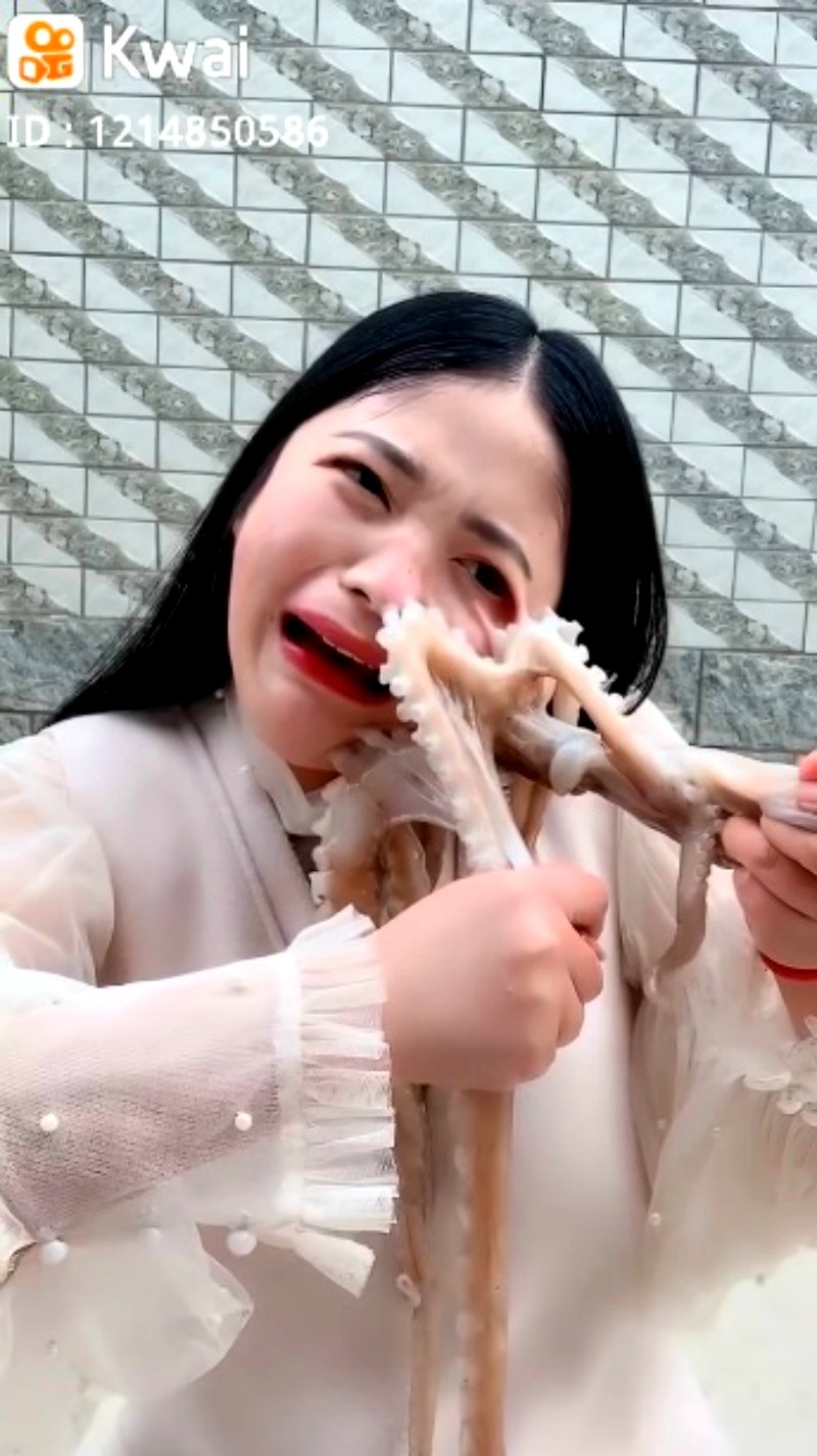 A Chinese livestreamer found her face writhing in pain as an octopus tried to defend itself in her attempts to eat it alive.