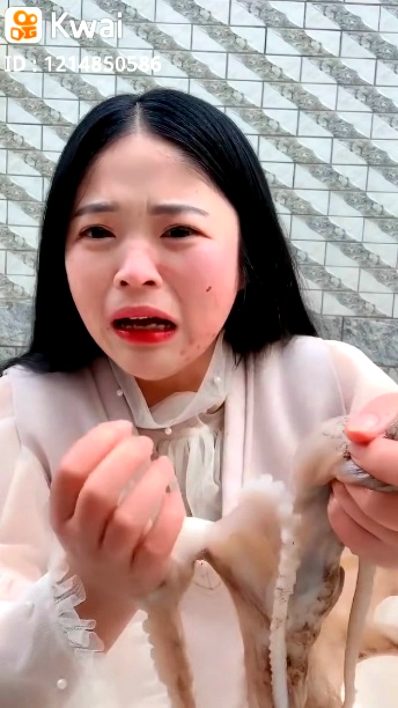 A Chinese livestreamer found her face writhing in pain as an octopus tried to defend itself in her attempts to eat it alive.