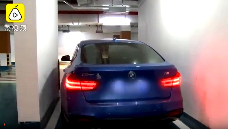 A Chinese woman is taking an apartment developer to court after finding out that the “premium” parking space she purchased won’t let her exit her car unless she passes through the sunroof.