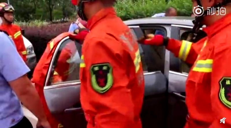 A woman in eastern China is being slammed on social media after trying to stop firefighters from breaking her car window to save her two-year-old son trapped inside the vehicle.