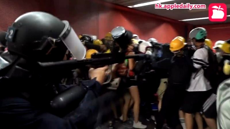 A police officer shot pepper balls point-blank at a group of protesters in Hong Kong over the weekend.