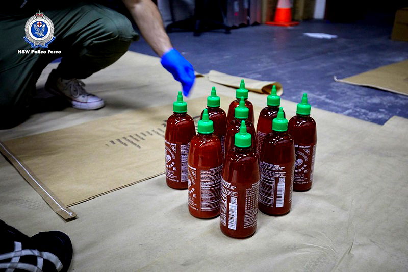 Four Australian men have been arrested for smuggling 400 kilograms (881 pounds) of methylamphetamine inside hundreds of bottles of the popular Asian hot sauce sriracha.