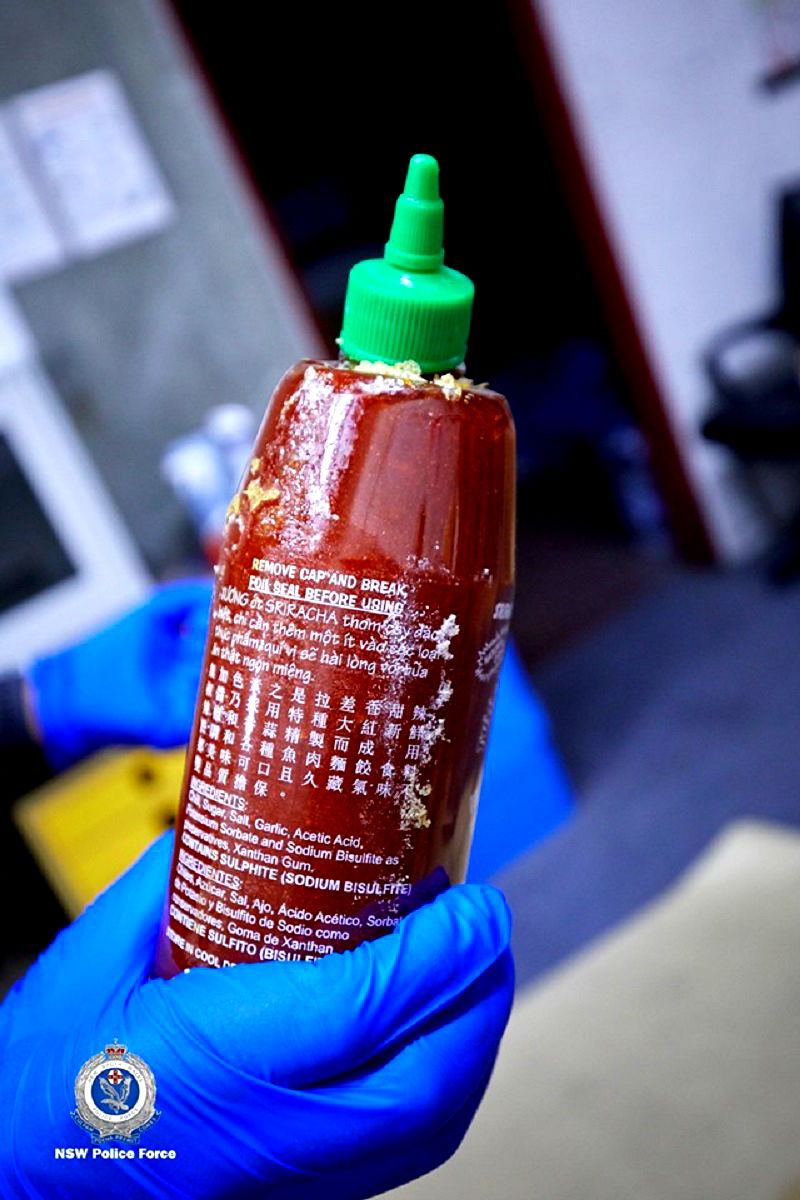 Four Australian men have been arrested for smuggling 400 kilograms (881 pounds) of methylamphetamine inside hundreds of bottles of the popular Asian hot sauce sriracha.