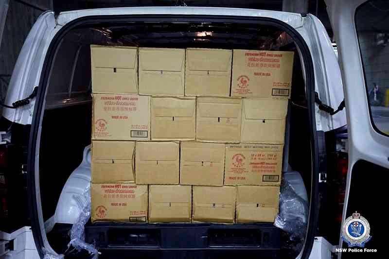 Four Australian men have been arrested for smuggling 400 kilograms (881 pounds) of methylamphetamine inside hundreds of bottles of the popular Asian hot sauce sriracha.