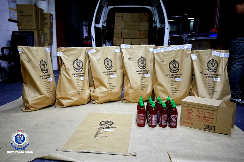 Four Australian men have been arrested for smuggling 400 kilograms (881 pounds) of methylamphetamine inside hundreds of bottles of the popular Asian hot sauce sriracha.