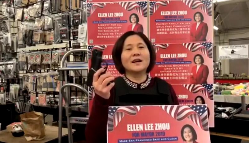 Ellen Lee Zhou, whose supporters have branded as the “Chinese Donald Trump,” sponsored the billboard showing a Black woman in a red dress and heels with her feet up, holding a cigarette in one hand and a stack of cash in the other.