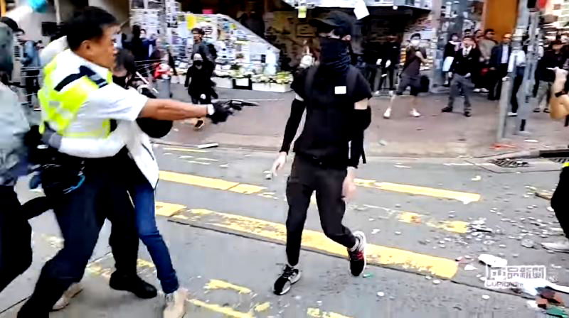 Two protesters have been shot by Hong Kong police during a confrontation in a general strike on Monday.