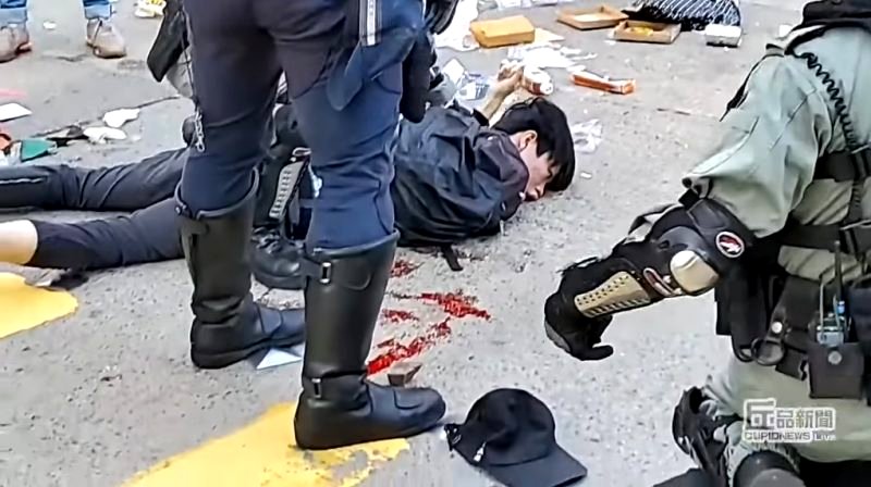 Two protesters have been shot by Hong Kong police during a confrontation in a general strike on Monday.