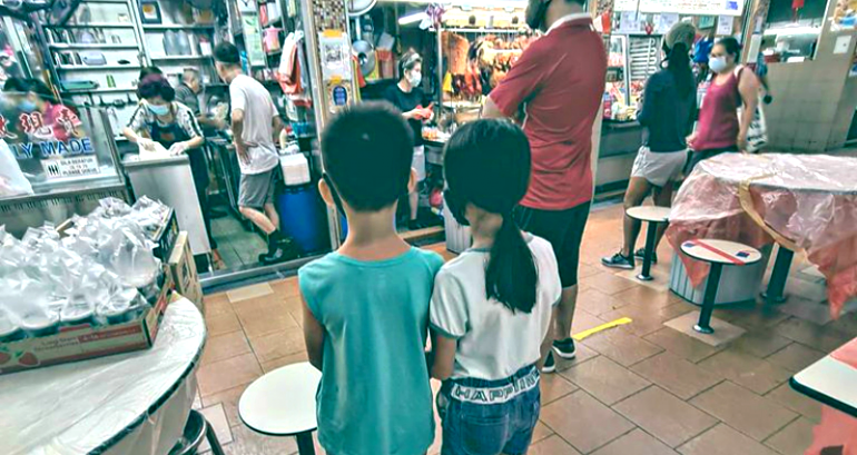Best Brother Ever Holds Sister’s Hand as She Nervously Orders Food in Singapore