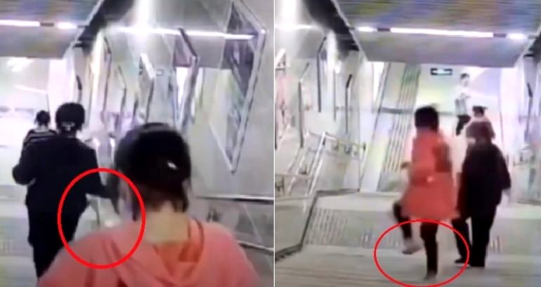 Woman Staring at Her Phone Falls Head First Down Flight of Stairs