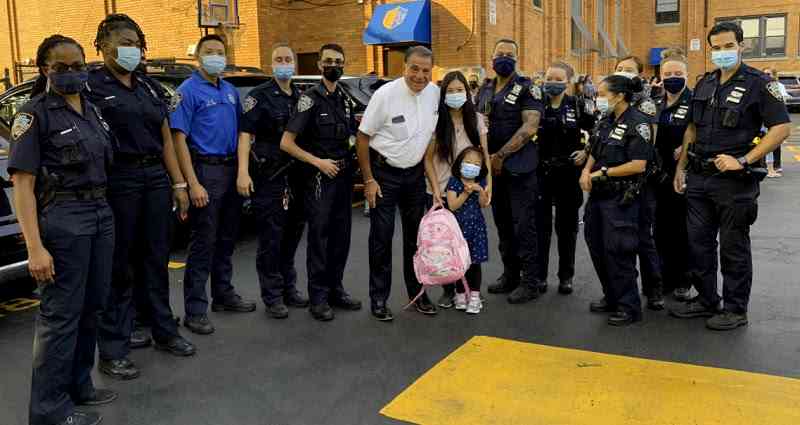 ‘Miracle’ daughter born two years after her father’s death is escorted by NYPD to her first day of school