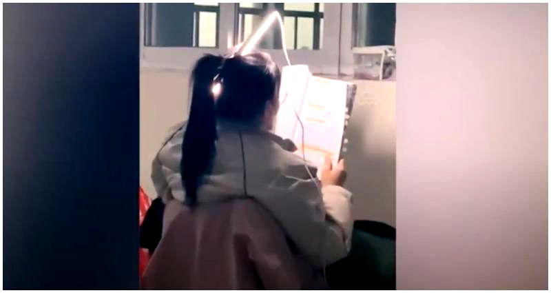 Chinese student who placed fluorescent light in her hair to study during power outage goes viral