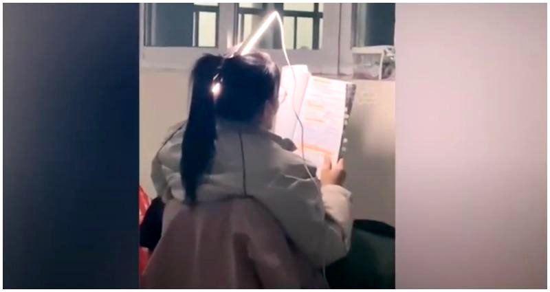 Chinese student who placed fluorescent light in her hair to study during power outage goes viral