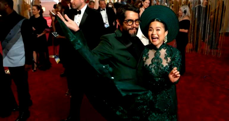 Vietnamese American actor Kelly Marie Tran arrives to the Oscars wearing a green ao dai