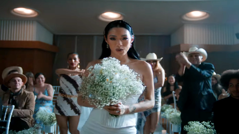 Rina Sawayama fearlessly line dances down the aisle in new music video for her single ‘This Hell’