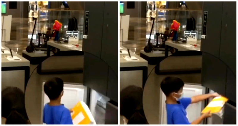 Chinese boy is caught on video trying to hide homework in display refrigerator at store