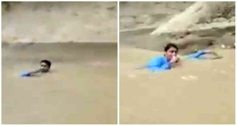 Pakistani journalist reporting on deadly floods while neck-deep in water goes viral