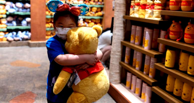 Disney Store Japan sells merch featuring Winnie the Pooh holding up blank white paper