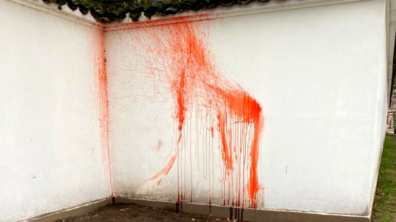 Men in clown wigs splatter fake blood onto walls of Vancouver’s Chinese garden