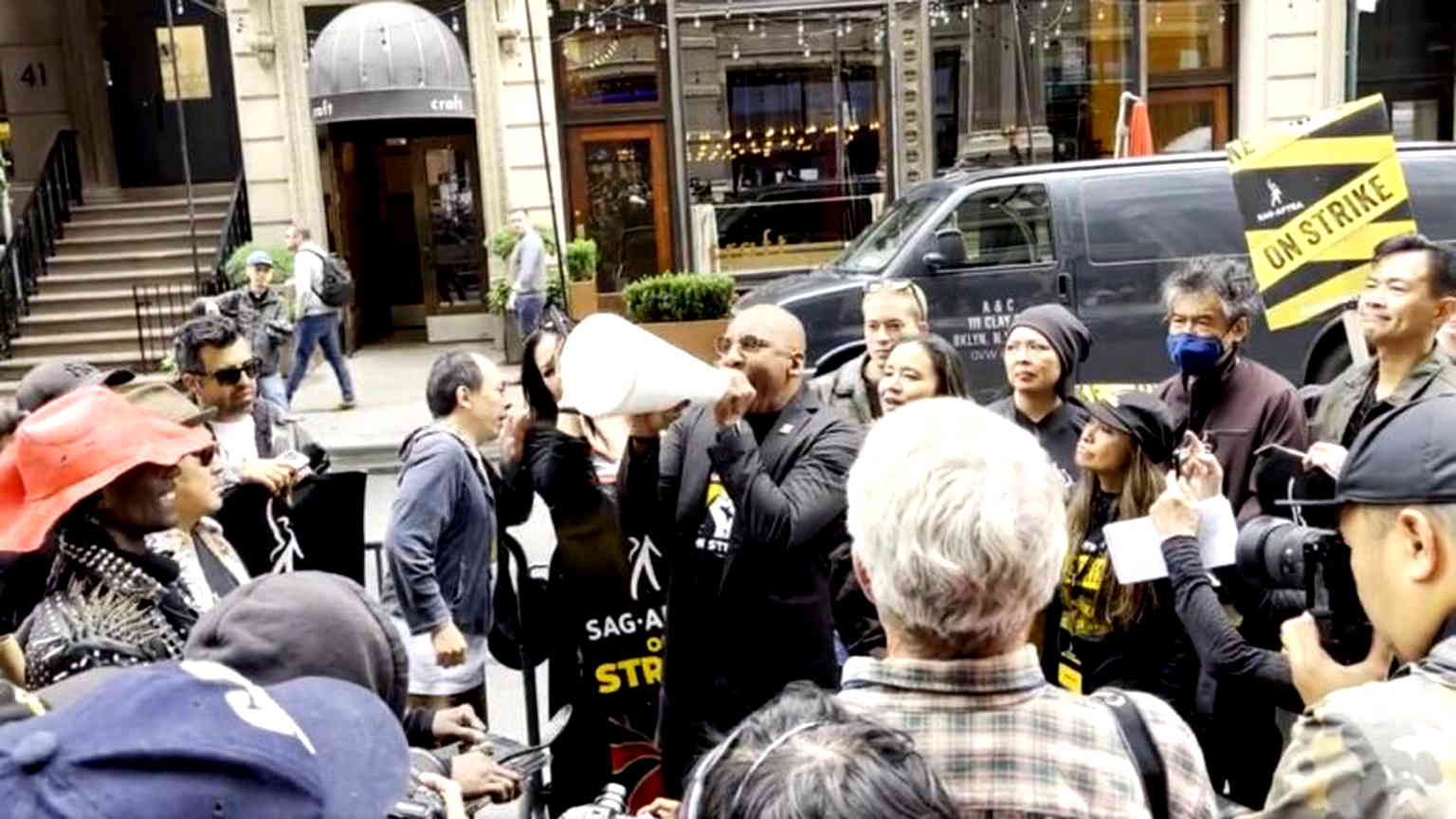 Writers show support for striking actors at AAPI-themed rally in Manhattan